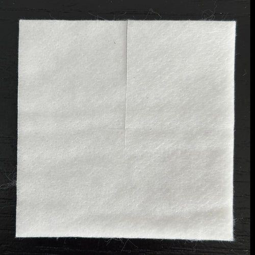 Square washable Pell pegpad on a black background